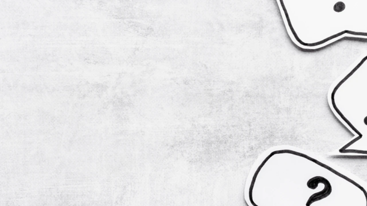 Two mint chocolate milkshakes with whipped cream and green sprinkles.